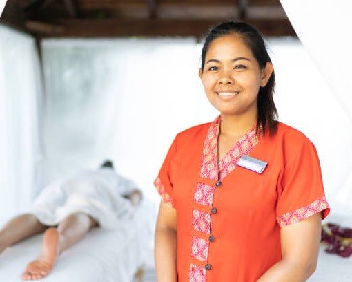 Portrait of smiling massage therapist looking at camera